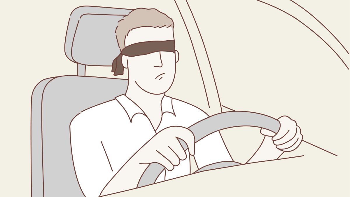 Mann Sitzt am Steuer des Autos mit Augenbinde.